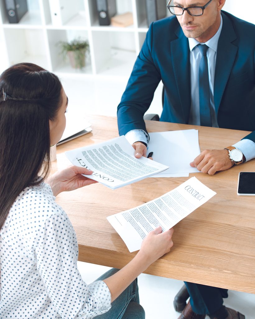 high-angle-view-of-lawyer-and-client-discussing-co-2021-08-31-14-46-03-utc